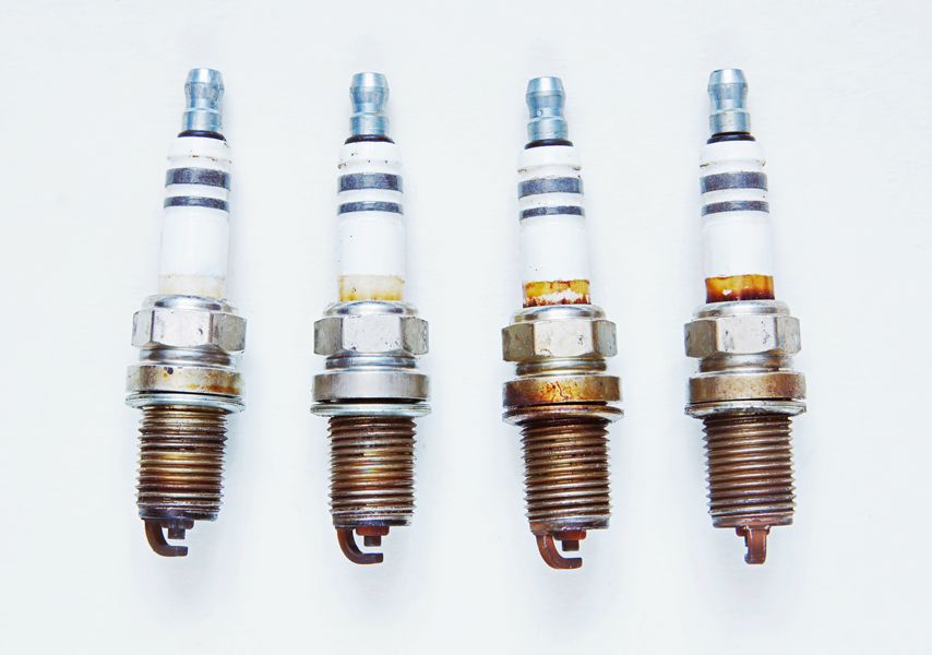 Maintaining Your Generator. Image is a photograph of four plugs on a white background.