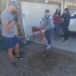 The Hamstra team planting a tree at a charity event.