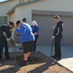 The Hamstra team planting a tree.